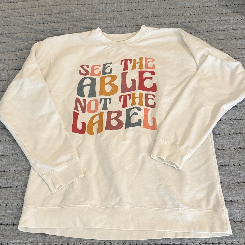 Cream Sweatshirt with Multicolor Graphic Text